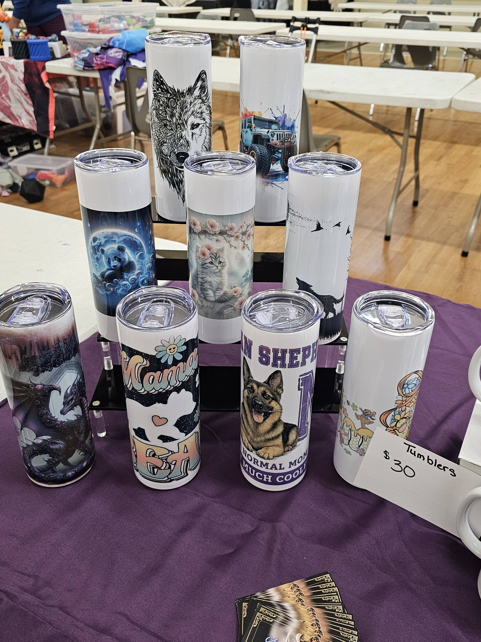 Market booth display with handmade and custom-print items